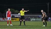 7 October 2022; Referee Damien MacGraith with Chris Forrester of St Patrick's Athletic, left, and Keith Ward of Dundalk during the SSE Airtricity League Premier Division match between Dundalk and St Patrick's Athletic at Casey's Field in Dundalk, Louth. Photo by Seb Daly/Sportsfile