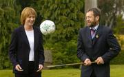 28 May 2004; Mary Davis, CEO of the Special Olympics World Summer Games 2003, looks on as GAA President Sean Kelly practices his ball control at the inaugural business of sport conference, which dealt with key issues relating to the sports industry and provided an insight into sponsorship, investment, attracting events to Ireland and athlete and player issues. O'Reilly Hall, UCD, Belfield, Dublin. Picture credit; Pat Murphy / SPORTSFILE