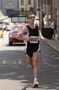 29 May 2004; Neil Cusack, from Limerick, wins the 10k Calcutta Run, a race in aid of GOAL and the Arrupe Society for homeless children in Calcutta and Dublin. Law Society of Ireland, Blackhall Place, Dublin. Picture credit; Ray McManus / SPORTSFILE