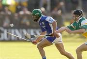 29 May 2004; Damien Culleton, Laois, is tackled by Mick O'Hara, Offaly. Guinness Leinster Senior Hurling Championship, Offaly v Laois, O' Connor Park, Tullamore, Co. Offaly. Picture credit; Matt Browne / SPORTSFILE