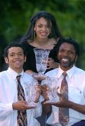 29 May 2004; Members of the Westbrooks family, from left, Isaac, Leah and dad Jerome, who were presented with the Under 20 Male Player of the Year, Under 16 Female Player of the Year and Underage Coach of the Year recpectively, at the Basketball Ireland awards at the Burlington Hotel, Dublin. Picture credit; Brendan Moran / SPORTSFILE