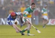 29 May 2004; Michael Cordial, Offaly, in action against James Young, Laois. Guinness Leinster Senior Hurling Championship, Offaly v Laois, O' Connor Park, Tullamore, Co. Offaly. Picture credit; Matt Browne / SPORTSFILE