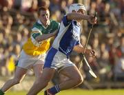 29 May 2004; Liam Tynan, Laois, in action against Barry Whelahan, Offaly. Guinness Leinster Senior Hurling Championship, Offaly v Laois, O' Connor Park, Tullamore, Co. Offaly. Picture credit; Matt Browne / SPORTSFILE