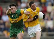 30 May 2004; Simon McDonagh, Antrim, in action against Oisin Doherty, Donegal. Ulster Minor Football Championship, Donegal v Antrim, McCool Park, Ballybofey, Co. Donegal. Picture credit; Damien Eagers / SPORTSFILE