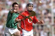 30 May 2004; Ben O'Connor, Cork, is tackled by Peter Lawlor, Limerick. Guinness Munster Senior Hurling Championship Semi-Final, Limerick v Cork, Gaelic Grounds, Limerick. Picture credit; Ray McManus / SPORTSFILE