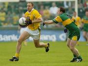 30 May 2004; Joseph Quinn, Antrim, in action against Adrian Sweeney, Donegal. Bank of Ireland Ulster Senior Football Championship, Donegal v Antrim, McCool Park, Ballybofey, Co. Donegal. Picture credit; Damien Eagers / SPORTSFILE