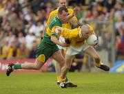 30 May 2004; Kevin McGourty, Antrim, in action against Barry Monaghan, Donegal. Bank of Ireland Ulster Senior Football Championship, Donegal v Antrim, McCool Park, Ballybofey, Co. Donegal. Picture credit; Damien Eagers / SPORTSFILE