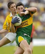 30 May 2004; Michael Hegarty, Donegal, is tackled by Sean Kelly, Antrim. Bank of Ireland Ulster Senior Football Championship, Donegal v Antrim, McCool Park, Ballybofey, Co. Donegal. Picture credit; Damien Eagers / SPORTSFILE