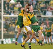 30 May 2004; Donegal pair Brendan Boyle, left, and Barry Monaghan, contest a high ball with Anto Finnegan, Antrim. Bank of Ireland Ulster Senior Football Championship, Donegal v Antrim, McCool Park, Ballybofey, Co. Donegal. Picture credit; Damien Eagers / SPORTSFILE
