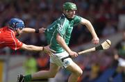 30 May 2004; Sean O'Connor, Limerick, is tackled by Ronan O'Connor, Cork. Guinness Munster Senior Hurling Championship Semi-Final, Limerick v Cork, Gaelic Grounds, Limerick. Picture credit; Ray McManus / SPORTSFILE