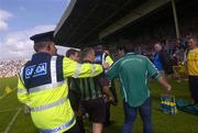 30 May 2004; A Limerick supporter remonstrates with referee Seamus Roche as he leaves the field. Guinness Munster Senior Hurling Championship Semi-Final, Limerick v Cork, Gaelic Grounds, Limerick. Picture credit; Ray McManus / SPORTSFILE
