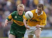 30 May 2004; Michael Pollock, Antrim, in action against Mark McPaul, Donegal. Ulster Minor Football Championship, Donegal v Antrim, McCool Park, Ballybofey, Co. Donegal. Picture credit; Damien Eagers / SPORTSFILE