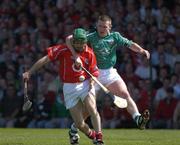30 May 2004; Jerry O'Connor, Cork, is tackled by Mark Foley, Limerick. Guinness Munster Senior Hurling Championship Semi-Final, Limerick v Cork, Gaelic Grounds, Limerick. Picture credit; Ray McManus / SPORTSFILE