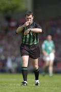 30 May 2004; Referee Seamus Roche indicates why he gave a free. Guinness Munster Senior Hurling Championship Semi-Final, Limerick v Cork, Gaelic Grounds, Limerick. Picture credit; Ray McManus / SPORTSFILE