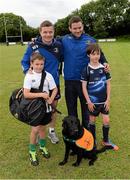 13 August 2013; Leinster players Brian O'Driscoll, left, and Fergus McFadden, pose for a photograph with Nathan Mullen, age 11, left, Jake Traynor, age 11, from Rathfarnham, and Jasper, a fundraising dog for Irish Guide Dogs, during a Leinster Rugby Summer Camp at DLSP RFC, Kirwan Park, Kilternan, Co. Dublin. Picture credit: Brian Lawless / SPORTSFILE