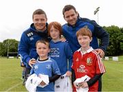 13 August 2013; Leinster players Brian O'Driscoll, left, and Fergus McFadden, with brothers, from left, Fintan, age 6, Aidan, age 10, and Ronan Kennedy, age 8, from Foxrock, Dublin, during a Leinster Rugby Summer Camp at DLSP RFC, Kirwan Park, Kilternan, Co. Dublin. Picture credit: Brian Lawless / SPORTSFILE