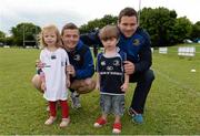 13 August 2013; Leinster players Brian O'Driscoll, left, and Fergus McFadden, with camp participants Aoibhe Verdon, age 3, from Dundrum, and Charlie Saunders, age 2, from Rathfarnham, during a Leinster Rugby Summer Camp at DLSP RFC, Kirwan Park, Kilternan, Co. Dublin. Picture credit: Brian Lawless / SPORTSFILE