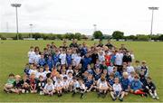 13 August 2013; Leinster players Brian O'Driscoll and Fergus McFadden with camp participants and coaches during a Leinster Rugby Summer Camp at DLSP RFC, Kirwan Park, Kilternan, Co. Dublin. Picture credit: Brian Lawless / SPORTSFILE