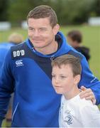 13 August 2013; Leinster's Brian O'Driscoll poses for a photograph with camp participant Keith Ahern, age 11, from Leopardstown, during a Leinster Rugby Summer Camp at DLSP RFC, Kirwan Park, Kilternan, Co. Dublin. Picture credit: Brian Lawless / SPORTSFILE