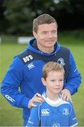 13 August 2013; Leinster's Brian O'Driscoll with camp participant Conor Hayes, age 9, from Leopardstown, during a Leinster Rugby Summer Camp at DLSP RFC, Kirwan Park, Kilternan, Co. Dublin. Picture credit: Brian Lawless / SPORTSFILE