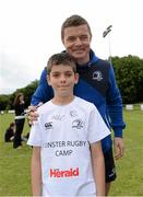 13 August 2013; Leinster's Brian O'Driscoll with camp participant Jude Pierse, age 11, from Sandyford, during a Leinster Rugby Summer Camp at DLSP RFC, Kirwan Park, Kilternan, Co. Dublin. Picture credit: Brian Lawless / SPORTSFILE