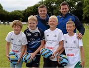13 August 2013; Leinster players Brian O'Driscoll, left, and Fergus McFadden, with camp participants, from left, Jack Crowe, age 11, from Kiltiernan, Michael Barry, age 12, Matthew Barry, age 11, and James Scully, age 11, all from Cabinteely, during a Leinster Rugby Summer Camp at DLSP RFC, Kirwan Park, Kilternan, Co. Dublin. Picture credit: Brian Lawless / SPORTSFILE