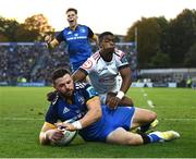 8 October 2022; Robbie Henshaw of Leinster scores his side's fifth try despite the tackle of Grant Williams of Cell C Sharks during the United Rugby Championship match between Leinster and Cell C Sharks at RDS Arena in Dublin. Photo by Harry Murphy/Sportsfile