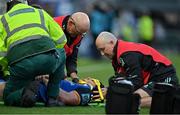 8 October 2022; Ryan Baird of Leinster receives medical attention from Leinster team doctor and exercise medicine consultant Dr Jim McShane and Leinster head physiotherapist Garreth Farrell before leaving the pitch on a stretcher during the United Rugby Championship match between Leinster and Cell C Sharks at RDS Arena in Dublin. Photo by Brendan Moran/Sportsfile