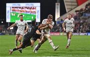 8 October 2022; Luke Marshall of Ulster is tackled by Keelan Giles of Ospreys on his way to scoring his side's first try during the United Rugby Championship match between Ulster and Ospreys at Kingspan Stadium in Belfast. Photo by Ramsey Cardy/Sportsfile
