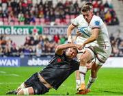 8 October 2022; Craig Gilroy of Ulster gets away from Will Griffiths of Ospreys during of Ulster that the ball was held up over the line during the United Rugby Championship match between Ulster and Ospreys at Kingspan Stadium in Belfast. Photo by John Dickson/Sportsfile
