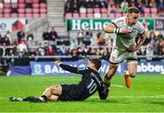 8 October 2022; Craig Gilroy of Ulster makes a break past Jack Walsh of Ospreys during the United Rugby Championship match between Ulster and Ospreys at Kingspan Stadium in Belfast. Photo by John Dickson/Sportsfile