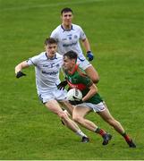 9 October 2022; Keith Evans of Mid Kerry in action against Patrick Clifford and Colin Crowley of Templenoe during the Kerry County Senior Club Football Championship quarter-final match between Mid Kerry and Templenoe at Fitzgerald Stadium in Killarney, Kerry. Photo by Brendan Moran/Sportsfile