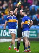 9 October 2022; Robbie Kehoe of O'Dempseys is shown a yellow card by referee Des Cooney during the Laois County Senior Football Championship Final match between O'Dempseys and Portarlington at MW Hire O'Moore Park in Portlaoise, Laois. Photo by Sam Barnes/Sportsfile