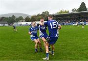 9 October 2022; Thomas Kelly of St Patrick's, right, celebrates with teammates Ciarán McGettigan and Jack Dunne after their side's victory in the Wicklow County Senior Football Championship Final match between Baltinglass and St Patrick's at the County Grounds in Aughrim, Wicklow. Photo by Harry Murphy/Sportsfile