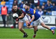 9 October 2022; Colm Murphy of Portarlington is tackled by Robbie Kehoe of O'Dempseys during the Laois County Senior Football Championship Final match between O'Dempseys and Portarlington at MW Hire O'Moore Park in Portlaoise, Laois. Photo by Sam Barnes/Sportsfile