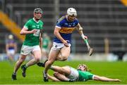 9 October 2022; Paull Flynn of Kiladangan in action against Liam Ryan of Drom and Inch during the Tipperary County Senior Hurling Championship Semi-Final match between Drom and Inch and Kiladangan at FBD Semple Stadium in Thurles, Tipperary. Photo by Michael P Ryan/Sportsfile