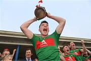 9 October 2022; Colmcille captain Jack Macken lifts the trophy after the Longford County Senior Football Championship Final match between Mullinalaghta St Columba's and Colmcille at Glennon Brothers Pearse Park in Longford. Photo by Ramsey Cardy/Sportsfile