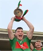 9 October 2022; Colmcille captain Jack Macken lifts the trophy after the Longford County Senior Football Championship Final match between Mullinalaghta St Columba's and Colmcille at Glennon Brothers Pearse Park in Longford. Photo by Ramsey Cardy/Sportsfile