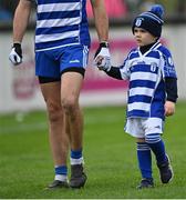 9 October 2022; Fionn Callaghan marches in the parade with his father Eamonn Callaghan of Naas before the Kildare County Senior Football Championship Final match between Clane and Naas at St Conleth's Park in Newbridge, Kildare. Photo by Piaras Ó Mídheach/Sportsfile