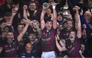 9 October 2022; Portarlington captain Keith Bracken, centre, lifts the cup as his team-mates celebrate after their side's victory in the Laois County Senior Football Championship Final match between O'Dempseys and Portarlington at MW Hire O'Moore Park in Portlaoise, Laois. Photo by Sam Barnes/Sportsfile