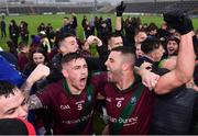 9 October 2022; Portarlington players including  Stuart Mulpeter, left, and Robbie Piggott, right, celebrate after their sides victory in the Laois County Senior Football Championship Final match between O'Dempseys and Portarlington at MW Hire O'Moore Park in Portlaoise, Laois. Photo by Sam Barnes/Sportsfile