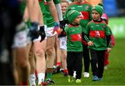 9 October 2022; Conor Cadam, left, and his brother Kian, walk with the Colmcille team in the pre-match parade before the Longford County Senior Football Championship Final match between Mullinalaghta St Columba's and Colmcille at Glennon Brothers Pearse Park in Longford. Photo by Ramsey Cardy/Sportsfile