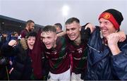 9 October 2022; Portarlington players Cathal Bennett, 2, and Ronan Coffey, 15, celebrate with supporters after their sides victory in the Laois County Senior Football Championship Final match between O'Dempseys and Portarlington at MW Hire O'Moore Park in Portlaoise, Laois. Photo by Sam Barnes/Sportsfile