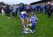 9 October 2022; Naas captain Eoin Doyle with his daughter Isla, age 5, and the Dermot Bourke Cup after the Kildare County Senior Football Championship Final match between Clane and Naas at St Conleth's Park in Newbridge, Kildare. Photo by Piaras Ó Mídheach/Sportsfile