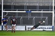 9 October 2022; Portarlington goalkeeper Scott Osbourne saves a penalty from Mark Barry of O'Dempseys during the Laois County Senior Football Championship Final match between O'Dempseys and Portarlington at MW Hire O'Moore Park in Portlaoise, Laois. Photo by Sam Barnes/Sportsfile