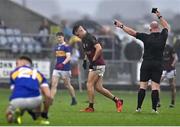 9 October 2022; Ronan Coffey of Portarlington is shown a black card by referee Des Cooney during the Laois County Senior Football Championship Final match between O'Dempseys and Portarlington at MW Hire O'Moore Park in Portlaoise, Laois. Photo by Sam Barnes/Sportsfile
