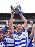 9 October 2022; Naas captain Eoin Doyle lifts the Dermot Bourke Cup after his side's victory in the Kildare County Senior Football Championship Final match between Clane and Naas at St Conleth's Park in Newbridge, Kildare. Photo by Piaras Ó Mídheach/Sportsfile