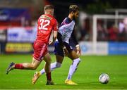 3 October 2022; Barry Cotter of St Patrick's Athletic and Kameron Ledwidge of Shelbourne during the SSE Airtricity League Premier Division match between Shelbourne and St Patrick's Athletic at Tolka Park in Dublin. Photo by Ben McShane/Sportsfile