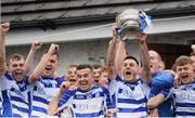 9 October 2022; Naas captain Eoin Doyle lifts the Dermot Bourke Cup after his side's victory in the Kildare County Senior Football Championship Final match between Clane and Naas at St Conleth's Park in Newbridge, Kildare. Photo by Stephen Marken/Sportsfile