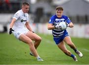 9 October 2022; Tom Browne of Naas in action against Sam McCormack of Clane during the Kildare County Senior Football Championship Final match between Clane and Naas at St Conleth's Park in Newbridge, Kildare. Photo by Stephen Marken/Sportsfile